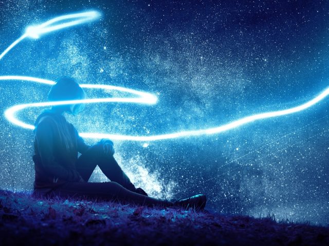 Photo by Илья Мельниченко person seated on grass